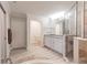 Spacious bathroom with double sinks, a large shower, and a soaking tub at 14009 Black Beauty Dr # 212, Punta Gorda, FL 33955
