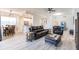 Open concept living room with modern furniture and laminate flooring at 14009 Black Beauty Dr # 212, Punta Gorda, FL 33955