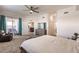 Main bedroom with king bed, access to balcony, and large windows at 14009 Black Beauty Dr # 212, Punta Gorda, FL 33955