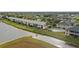 Aerial view of condo community by the lake with pool at 1512 Rio De Janeiro Ave # 111, Punta Gorda, FL 33983