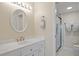 Updated bathroom with white vanity, marble shower, and modern fixtures at 1512 Rio De Janeiro Ave # 111, Punta Gorda, FL 33983