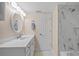 Bathroom with a white vanity, marble countertop, and a shower/tub combo at 1512 Rio De Janeiro Ave # 111, Punta Gorda, FL 33983