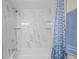 Bathroom with a bathtub and marble shower surround at 1512 Rio De Janeiro Ave # 111, Punta Gorda, FL 33983