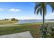 Peaceful lake view from condo with lush landscaping at 1512 Rio De Janeiro Ave # 111, Punta Gorda, FL 33983