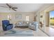 Relaxing living room with comfy seating, large windows, and access to patio at 1512 Rio De Janeiro Ave # 111, Punta Gorda, FL 33983