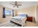 Spacious main bedroom with water views, ceiling fan, and ample closet space at 1512 Rio De Janeiro Ave # 111, Punta Gorda, FL 33983