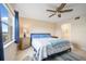 Comfortable main bedroom with lake view, ceiling fan, and en-suite bathroom at 1512 Rio De Janeiro Ave # 111, Punta Gorda, FL 33983