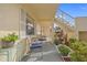 Small patio with seating and potted plants at 1512 Rio De Janeiro Ave # 111, Punta Gorda, FL 33983