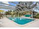 Community pool with covered patio and seating at 1512 Rio De Janeiro Ave # 111, Punta Gorda, FL 33983