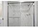Large marble shower with glass enclosure and modern fixtures at 1512 Rio De Janeiro Ave # 111, Punta Gorda, FL 33983