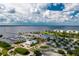 Aerial view of waterfront community with marina, restaurants, and parking at 1650 W Marion Ave # 144, Punta Gorda, FL 33950