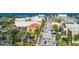 Aerial view of a downtown street lined with palm trees and buildings at 1650 W Marion Ave # 144, Punta Gorda, FL 33950