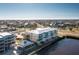 Aerial view of a waterfront building with a neighboring building and canal at 1650 W Marion Ave # 144, Punta Gorda, FL 33950