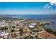 Aerial view of a coastal city featuring a waterfront, bridge, and downtown area at 1650 W Marion Ave # 144, Punta Gorda, FL 33950