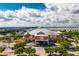 Aerial view of a commercial building near a waterfront with parking and bridge in background at 1650 W Marion Ave # 144, Punta Gorda, FL 33950