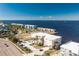 An aerial view of a waterfront property with a building and a pool nearby at 1650 W Marion Ave # 144, Punta Gorda, FL 33950