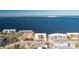 Aerial view of waterfront community, featuring multiple buildings and a marina at 1650 W Marion Ave # 144, Punta Gorda, FL 33950