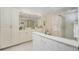 Bathroom with double vanity, shower, and neutral decor at 1650 W Marion Ave # 144, Punta Gorda, FL 33950
