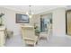 Bright dining room with glass-top table and elegant chairs at 1650 W Marion Ave # 144, Punta Gorda, FL 33950