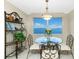 Elegant dining area with water views and a glass-top table at 1650 W Marion Ave # 144, Punta Gorda, FL 33950