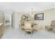 Spacious dining area with glass-top table and four chairs at 1650 W Marion Ave # 144, Punta Gorda, FL 33950