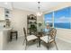 Bright dining room with water views and ornate chairs at 1650 W Marion Ave # 144, Punta Gorda, FL 33950