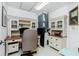 Home office with a desk, computer, and ample storage at 1650 W Marion Ave # 144, Punta Gorda, FL 33950