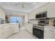 Modern kitchen with stainless steel appliances and water views at 1650 W Marion Ave # 144, Punta Gorda, FL 33950