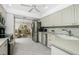 Open kitchen with stainless steel appliances and views to dining area at 1650 W Marion Ave # 144, Punta Gorda, FL 33950