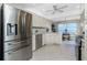 Modern kitchen featuring stainless steel appliances and white cabinetry at 1650 W Marion Ave # 144, Punta Gorda, FL 33950