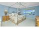Large bedroom with a canopy bed and water views at 1650 W Marion Ave # 144, Punta Gorda, FL 33950