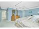 Main bedroom with a canopy bed and ensuite bathroom access at 1650 W Marion Ave # 144, Punta Gorda, FL 33950