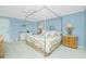 Serene main bedroom featuring a comfortable bed and light blue walls at 1650 W Marion Ave # 144, Punta Gorda, FL 33950