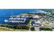 Aerial view of a marina with many boats, a clubhouse and parking area at 1650 W Marion Ave # 144, Punta Gorda, FL 33950