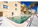 Relaxing community pool area with plenty of lounge chairs at 1650 W Marion Ave # 144, Punta Gorda, FL 33950