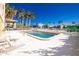 Community pool area with lounge chairs for sunbathing at 1650 W Marion Ave # 144, Punta Gorda, FL 33950