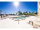 Community pool with lounge chairs, perfect for relaxation at 1650 W Marion Ave # 144, Punta Gorda, FL 33950
