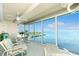 Spacious sunroom boasts stunning water views and relaxing furniture at 1650 W Marion Ave # 144, Punta Gorda, FL 33950