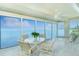 Bright sunroom with water views and comfortable seating at 1650 W Marion Ave # 144, Punta Gorda, FL 33950
