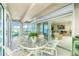 Relaxing sunroom offering water views and outdoor dining space at 1650 W Marion Ave # 144, Punta Gorda, FL 33950