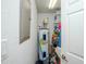 Utility closet with water heater and storage shelves at 1650 W Marion Ave # 144, Punta Gorda, FL 33950