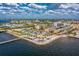Aerial view of waterfront property with tiki bar and hotel at 1650 W Marion Ave # 144, Punta Gorda, FL 33950