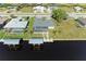 Aerial view of canal front home with private pool and dock at 21341 Edgewater Dr, Port Charlotte, FL 33952