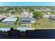 Aerial view of canal front home with private pool and dock at 21341 Edgewater Dr, Port Charlotte, FL 33952