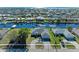 Aerial view showcasing canal front home and paved driveway at 21341 Edgewater Dr, Port Charlotte, FL 33952