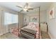 Playful bedroom with a canopy bed, colorful rug, and plenty of storage at 21341 Edgewater Dr, Port Charlotte, FL 33952
