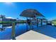 Private boat dock with covered lift and canal access at 21341 Edgewater Dr, Port Charlotte, FL 33952