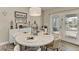 Charming dining area with a round table and access to the patio at 21341 Edgewater Dr, Port Charlotte, FL 33952