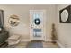 Bright entryway with a modern door and decorative accents at 21341 Edgewater Dr, Port Charlotte, FL 33952
