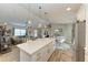 Modern kitchen with white cabinets, quartz countertops, and stainless steel appliances at 21341 Edgewater Dr, Port Charlotte, FL 33952